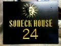 Hand Carved house sign, Welsh Slate, with Sun motif. Gilded and oiled.