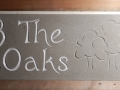 3 The Oaks, Hand carved and painted Forest of Dean sandstone