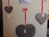 Chinese slate hearts on red ribbon. Different sizes and initials engraved to order.
