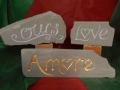 Amore ,hand carved and gilded £85, Love, hand carved and painted £45, Ours, hand carved and painted £58