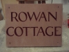 House name, Forest of Dean Sandstone, painted burgandy.
