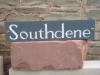 Welsh Slate house name, painted white.