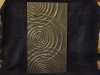 Intersecting ripples carved in Welsh slate