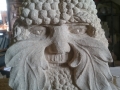 Green man with berries. Hand carved Tetbury limestone.