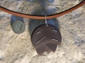 Pine cone pendant Welsh slate with sterling silver stitching.