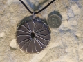 Spinning wheel Welsh slate pendant with sterling silver stitching-same both sides (showing my masons mark on the reverse.)